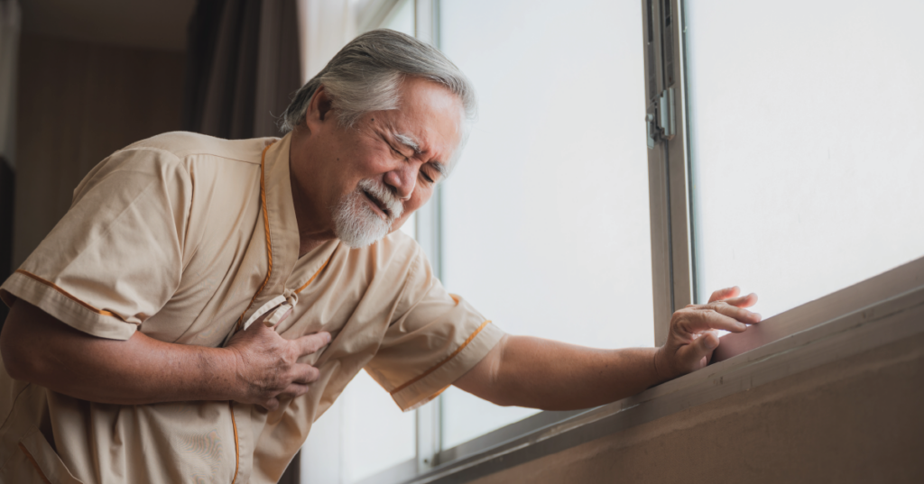 man experiencing chest pains, likely from heart disease